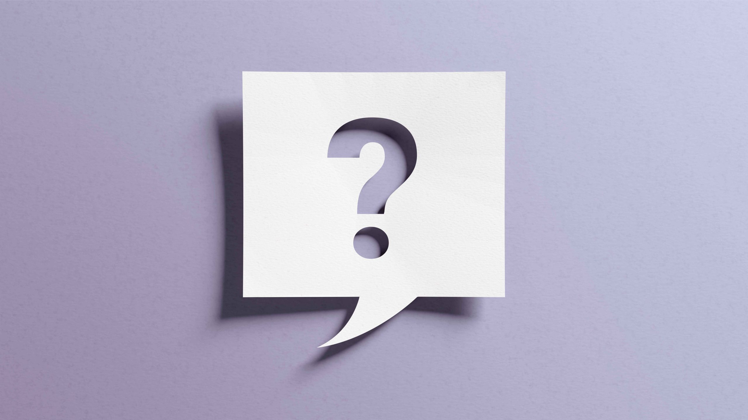 Close-up of a woman on a phone call, examining a prescription bottle. The image highlights the importance of professional consultation when managing medications during the recovery process.